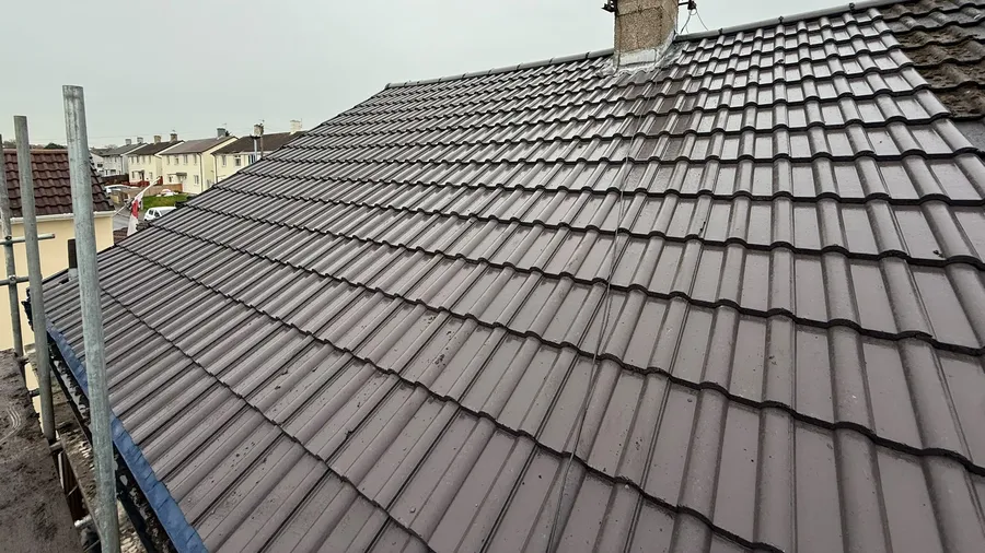 New interlocking tiles with fresh chimney flashing